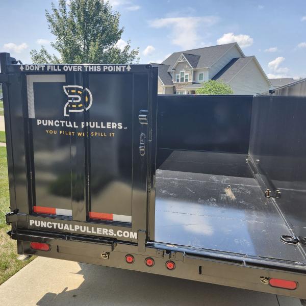 back of dumpster trailer with one door open