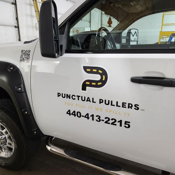 pickup truck side door with punctual pullers logo