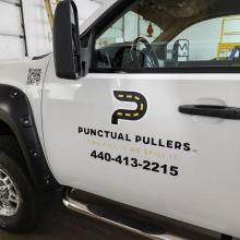 pickup truck side door with punctual pullers logo