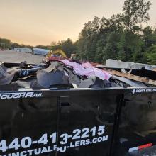 dumpster full at sunset